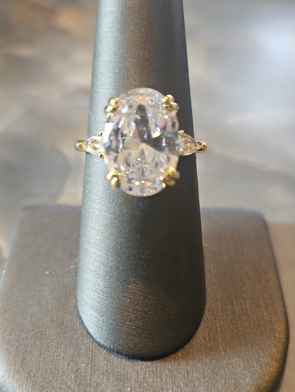 Gold-Plated Oval CZ Solitaire Ring with Side Stones - White